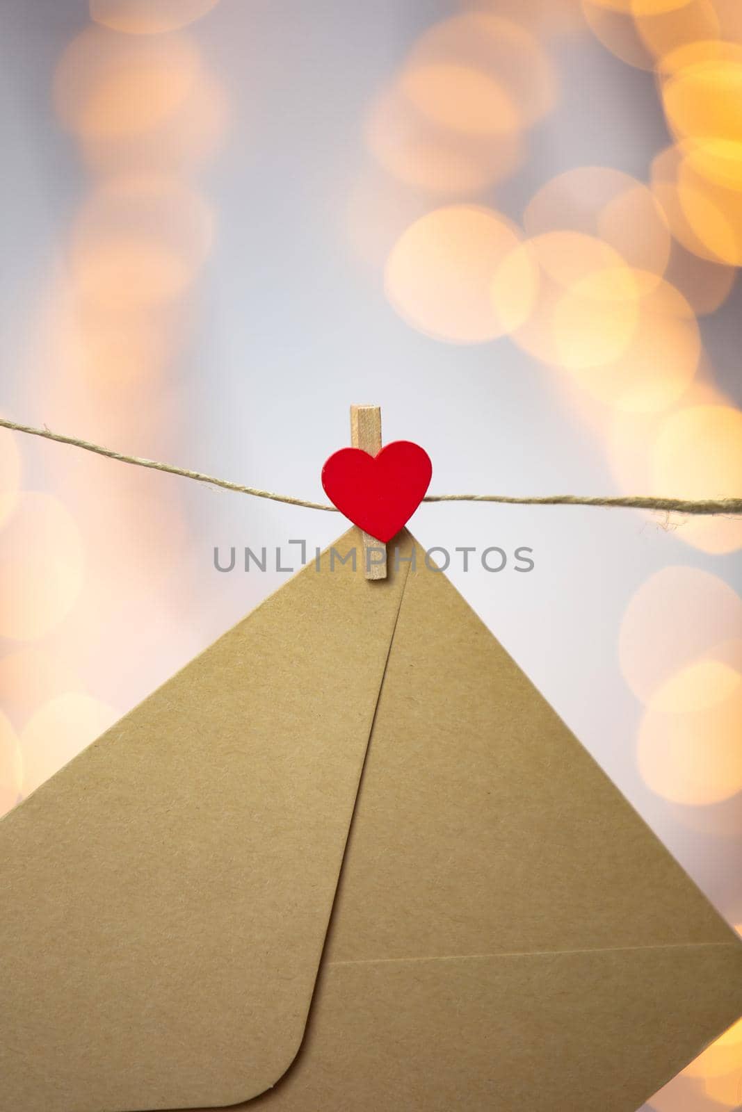 Blank letter, envelope or greeting card hanging with red hearts, romantic love letter , Valentines Day concept bokeh background, copy space romantic design