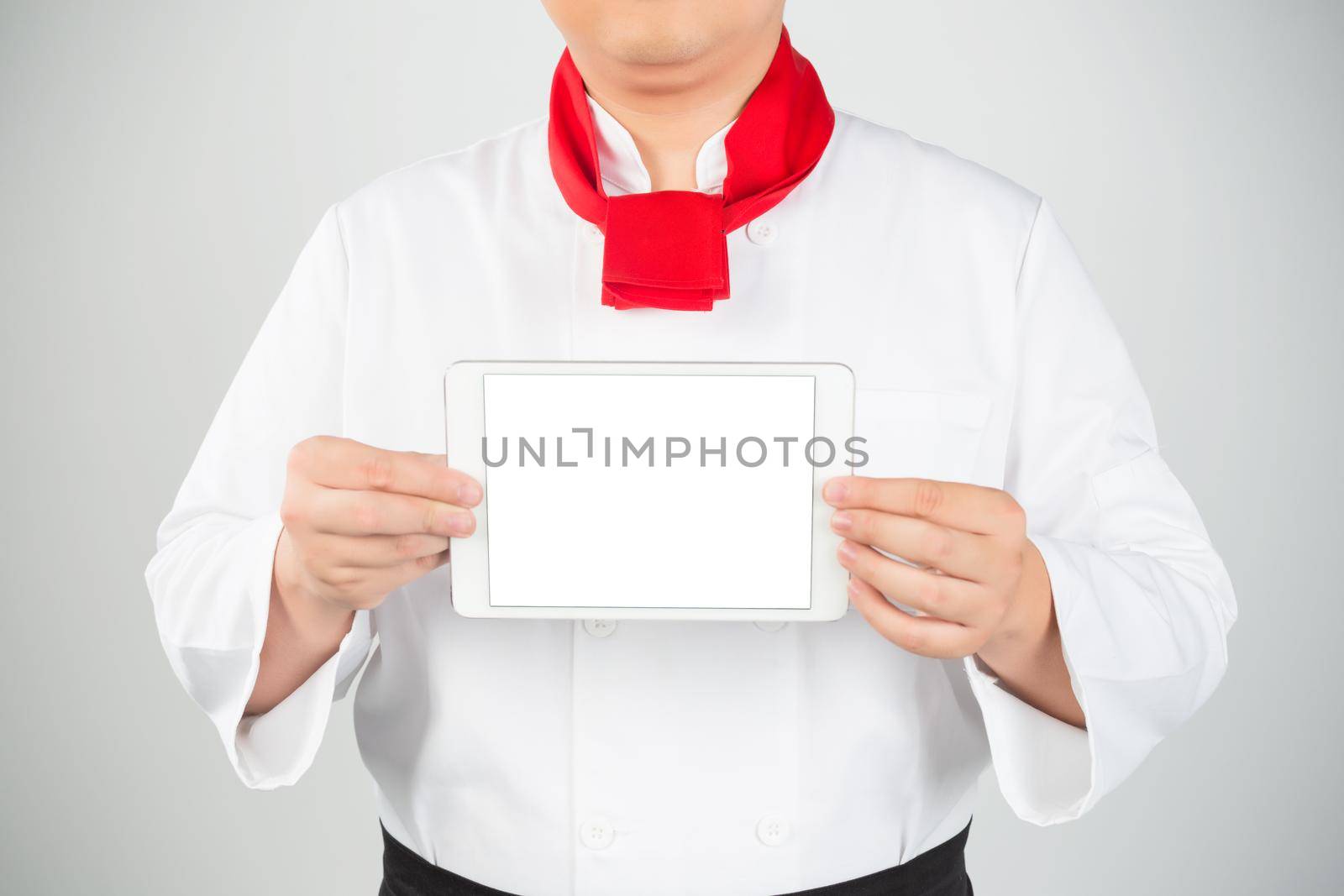 cooking, technology and home concept - closeup of man pointing finger to tablet pc computer