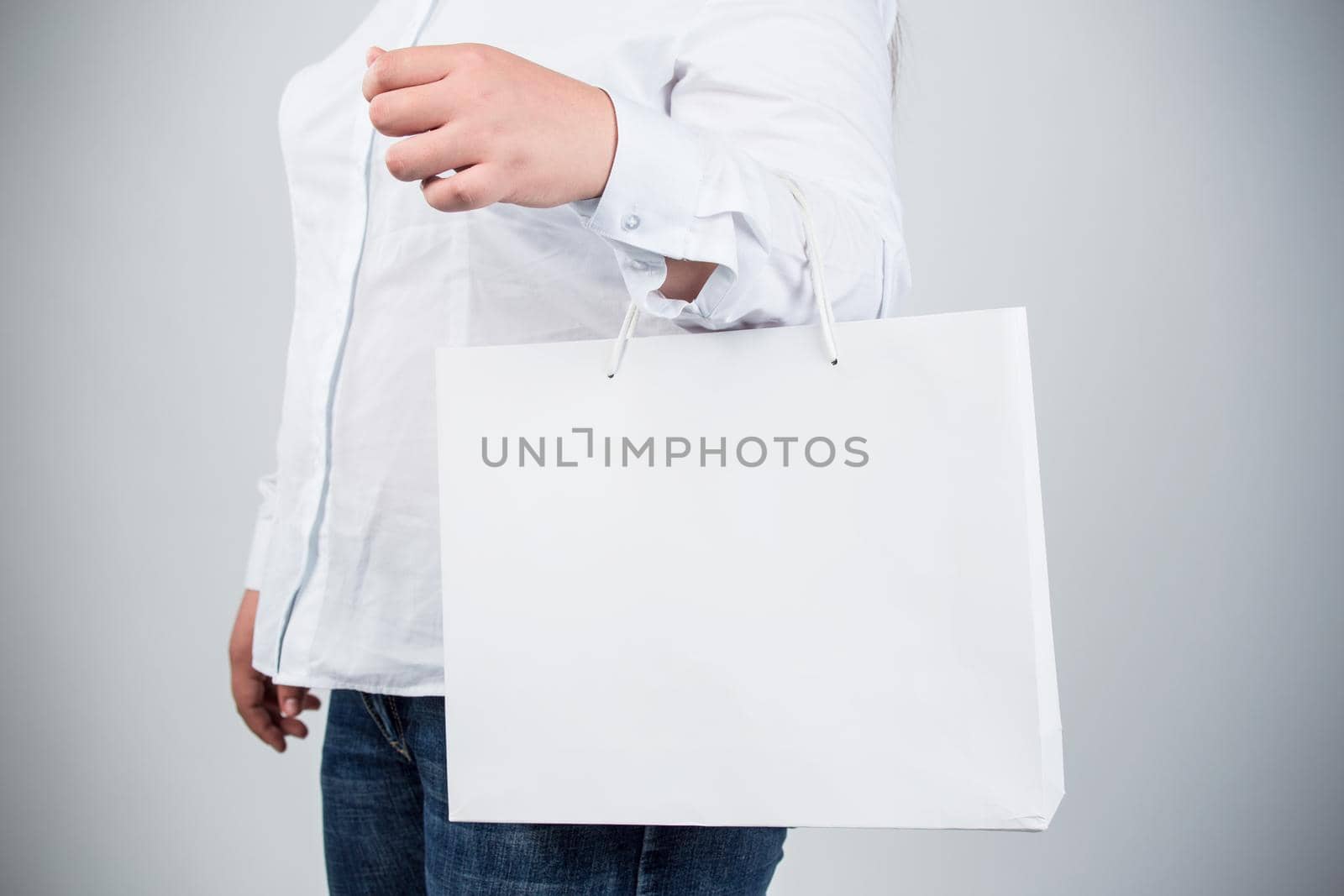 Woman hold shopping bag. Isolated portrait. by whatwolf