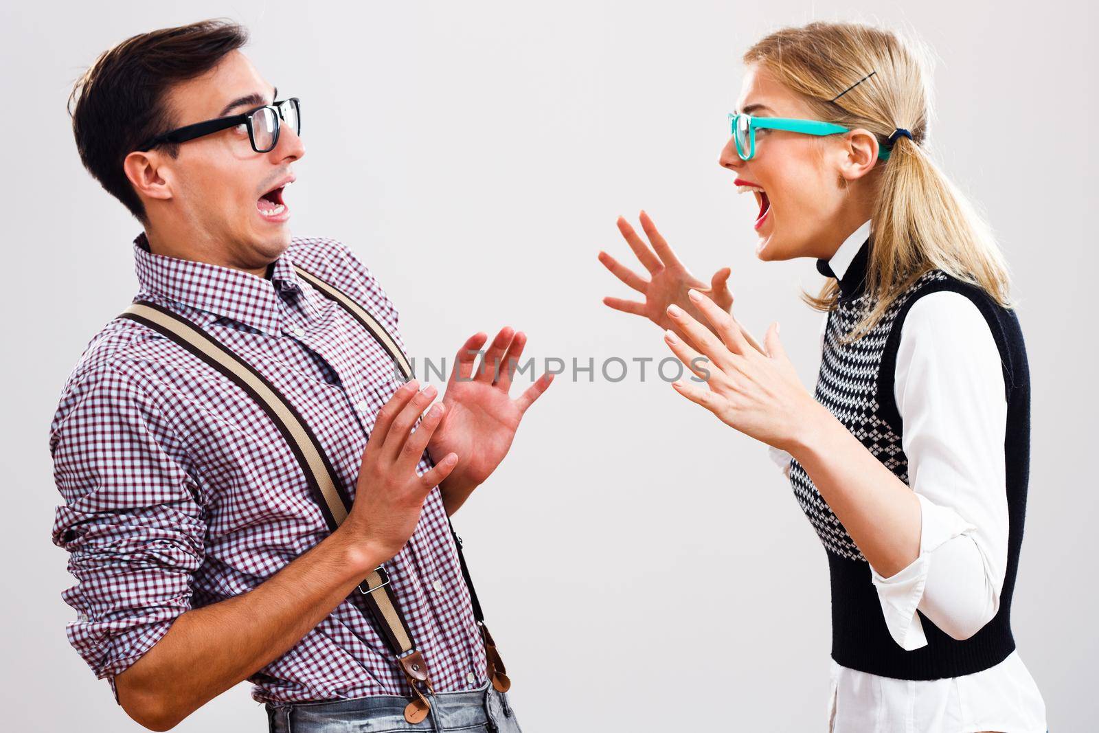 Nerdy man and woman having conflict.