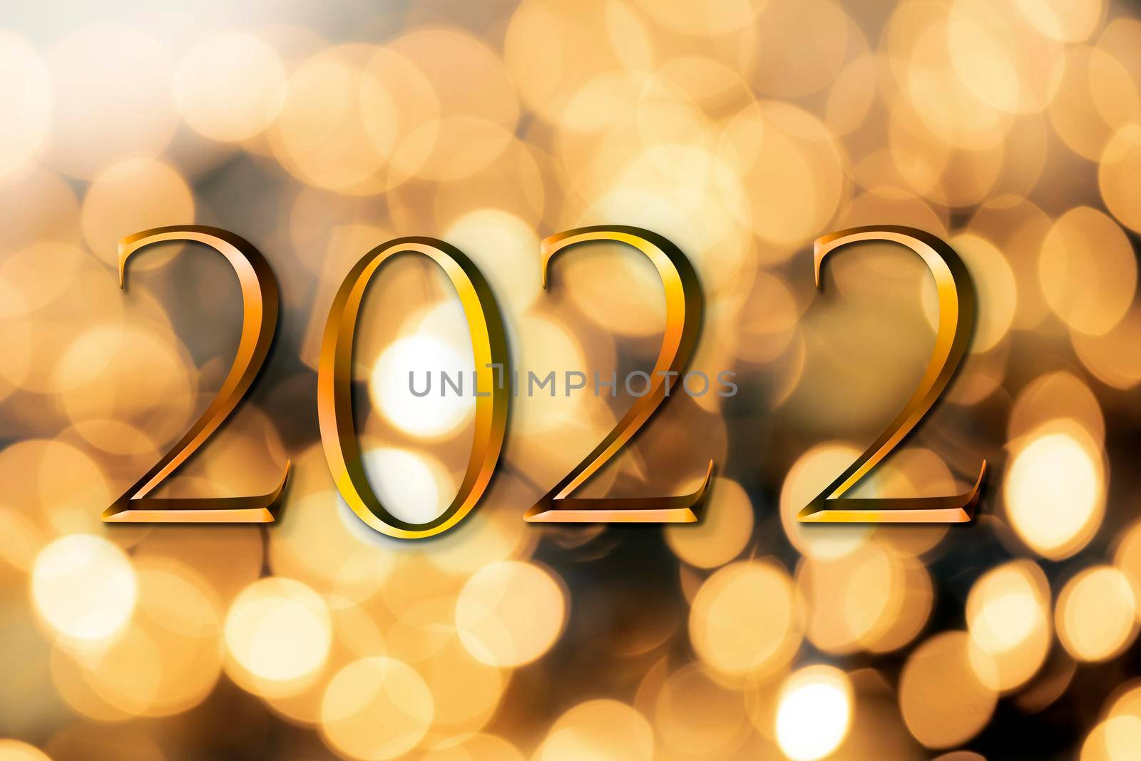 The year 2022 written on wooden cubes in gold luxury letters with shiny bokeh background, New Year celebration concept glitter beauty