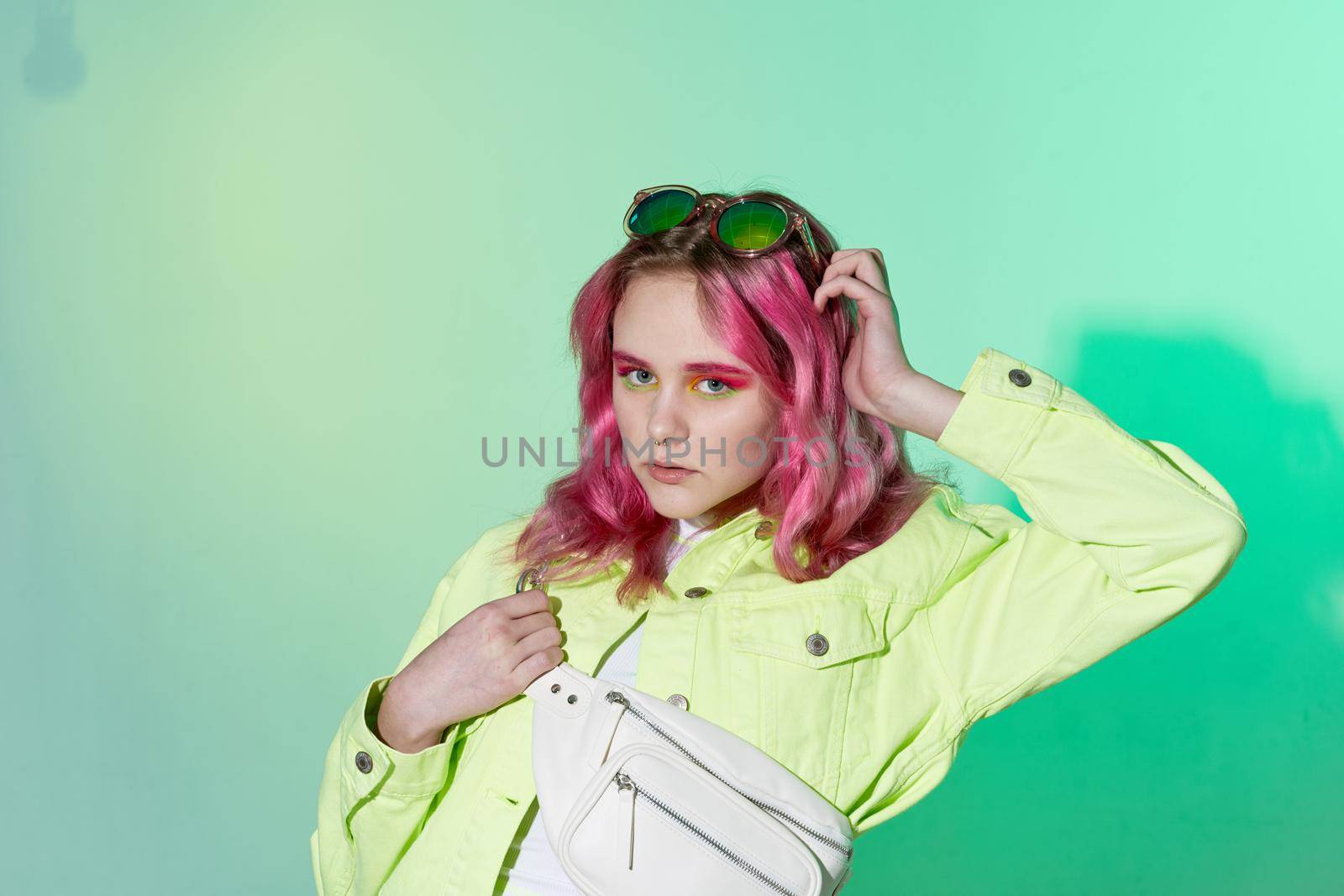 cheerful woman green jacket fashionable clothes isolated background. High quality photo