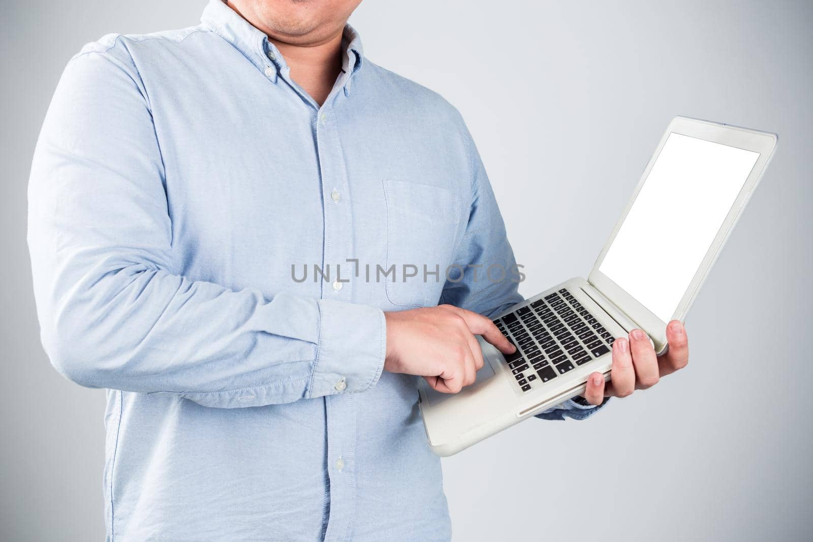 Business man with a laptop - isolated over a white background