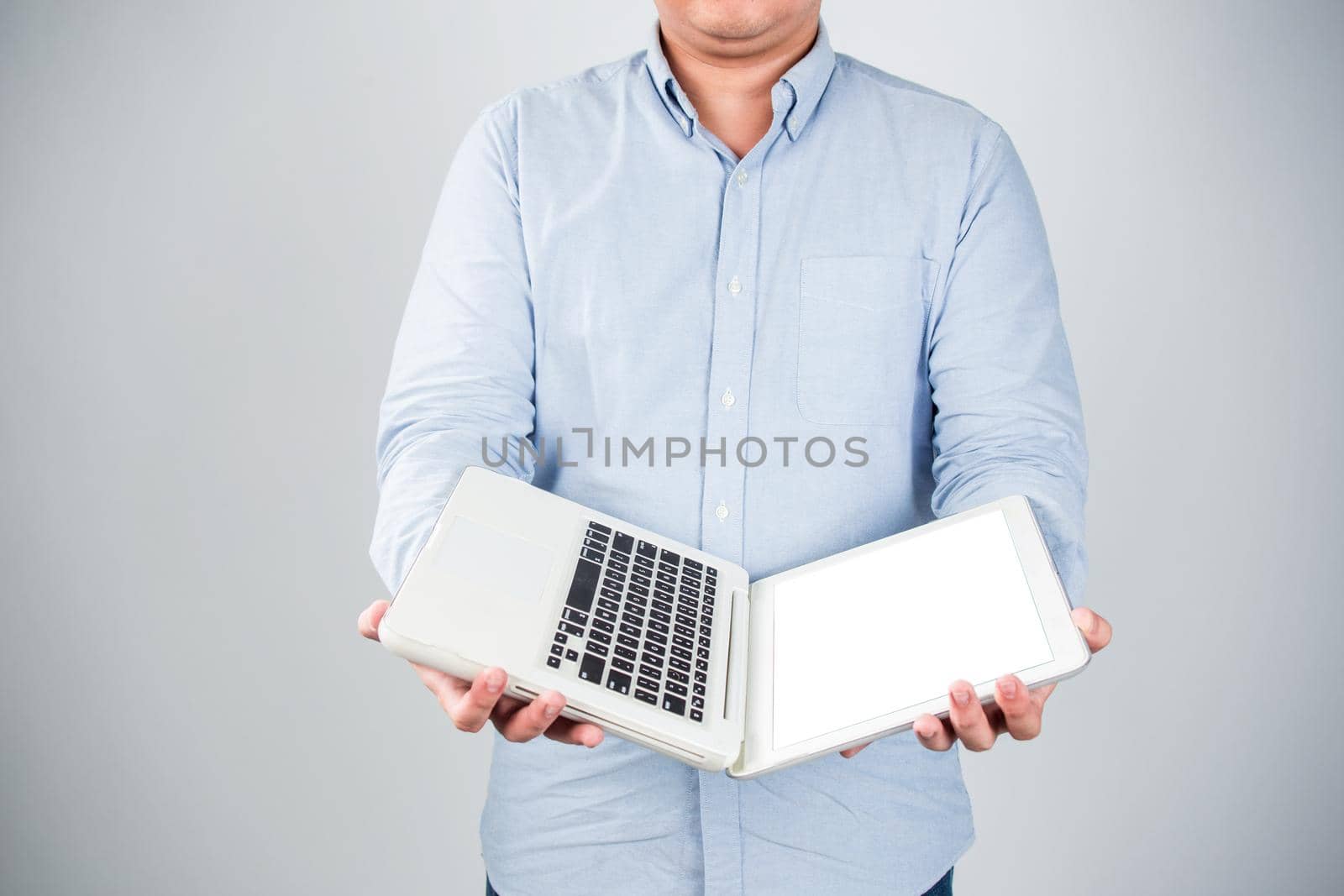 Business man with a laptop - isolated over a white background