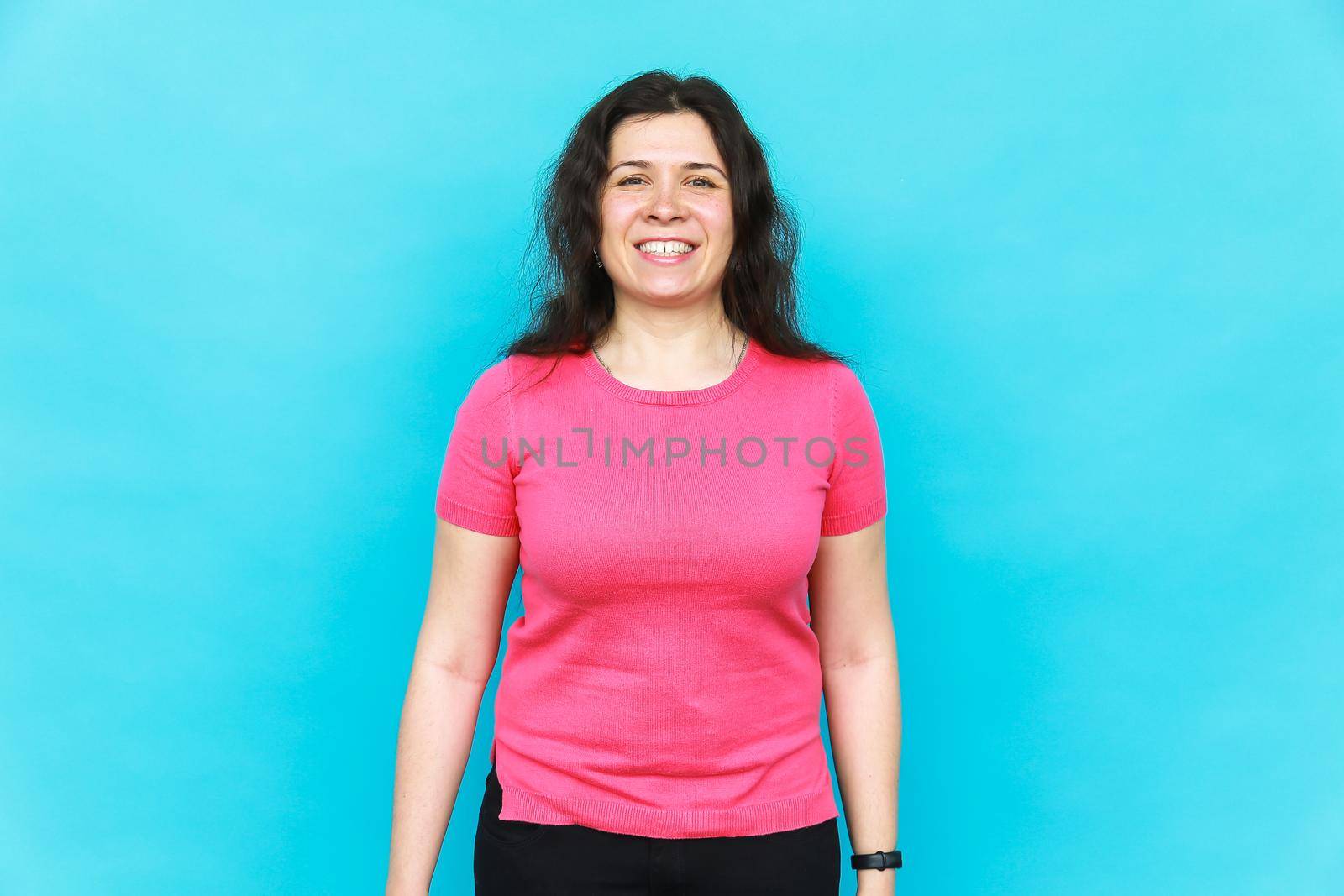 Portrait of bright beautiful girl with art colorful freckles make-up. Body positivity concept. Blue background. by Satura86