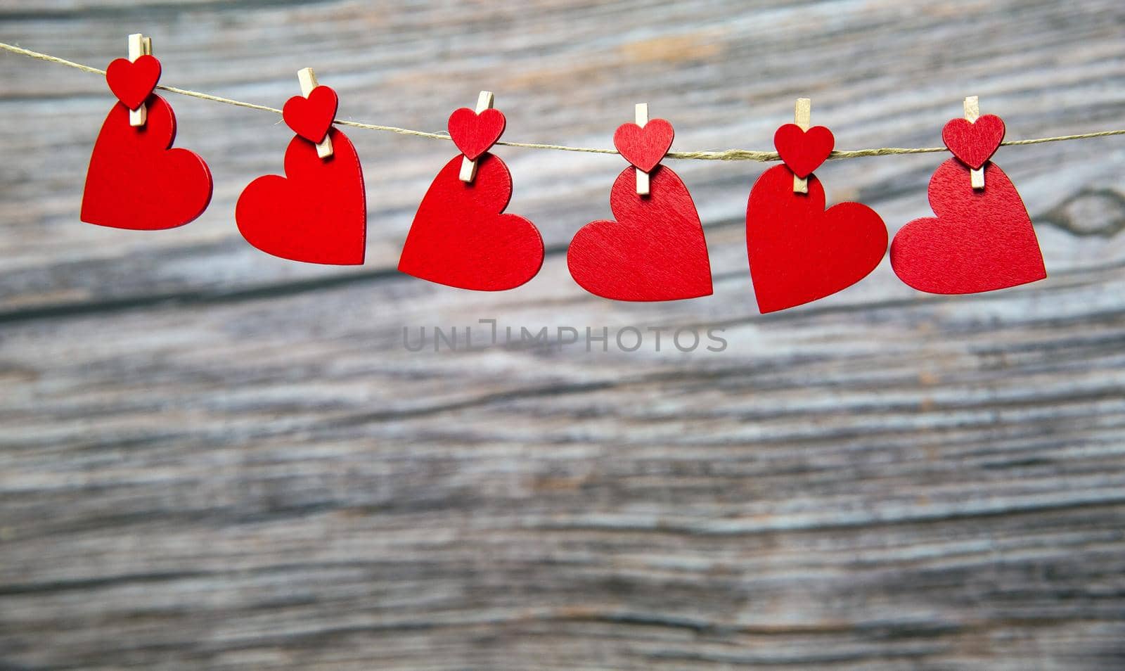Love concept, red hanging hearts on wooden background for Valentines Day, Mothers Day, Womans day,romantic design copy space space for text