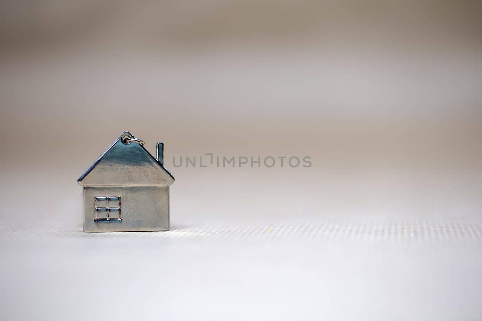 Little miniature house on blurred background, New home, Real Estate, Mortgage loan,architectural concept with Copy space space fot text