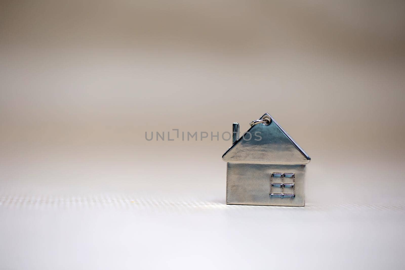 Little miniature house on blurred background, New home, Real Estate, Mortgage loan,architectural concept with Copy space space fot text