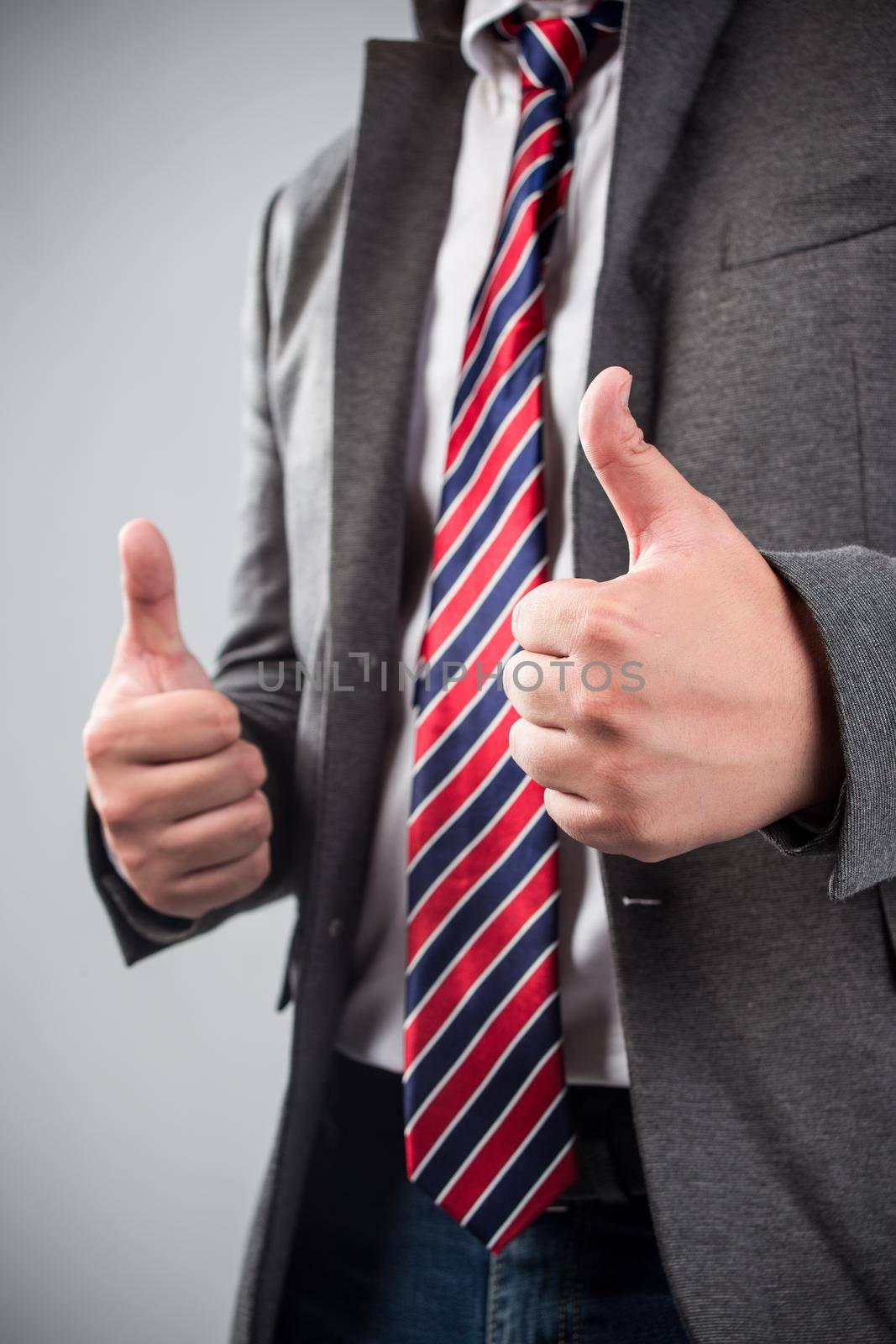 Business man shows thumb up by whatwolf