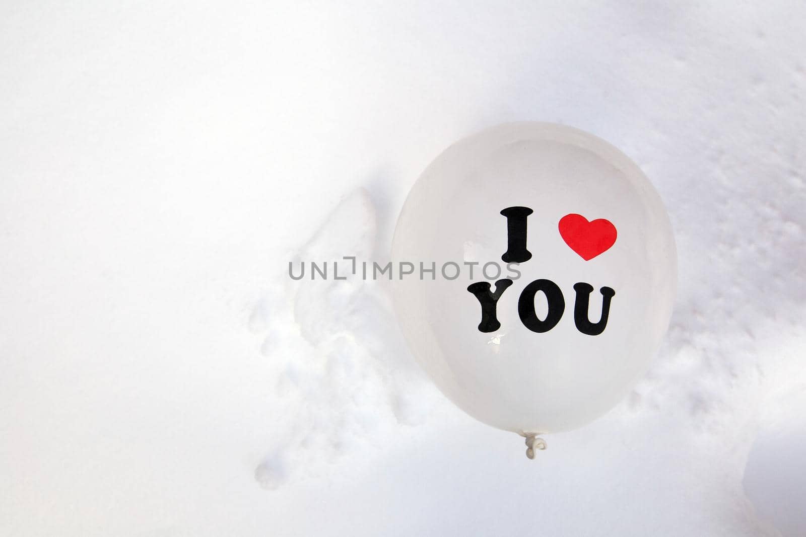 White Valentines Day balloon with the text I love you in fresh white snow background, Copy space, Love,winter,Valentine concept space for text