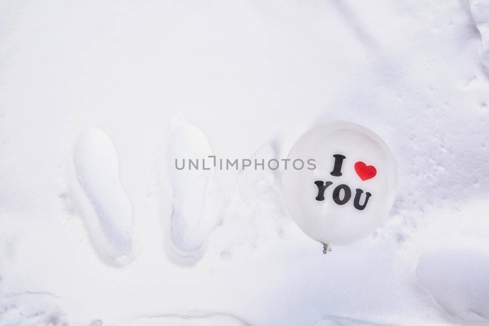 White Valentines Day balloon with the text I love you in fresh white snow background, Copy space, Love,winter,Valentine concept space for text