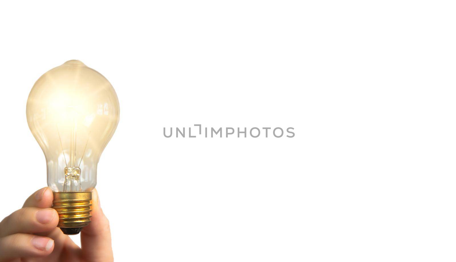 Hand holding glowing light bulb,finding innovative solutions and creative ideas, being unique, thinking different concept isolated on white background, copy space space for text