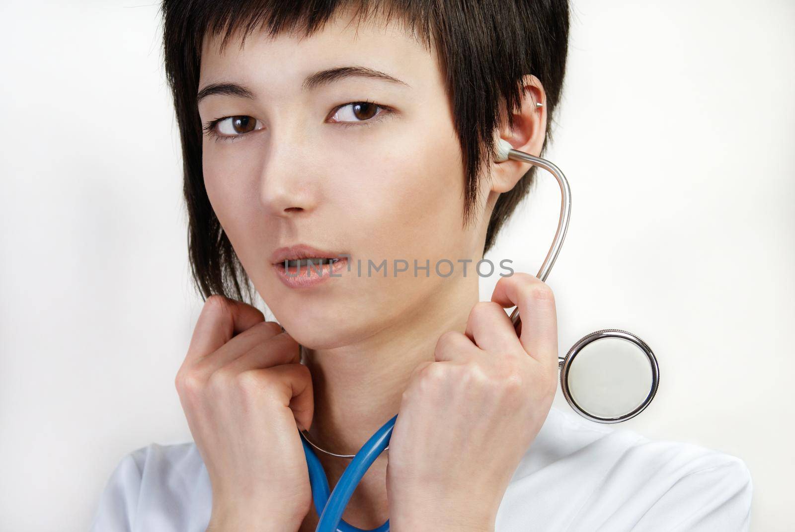 portrait of young woman in medical gown