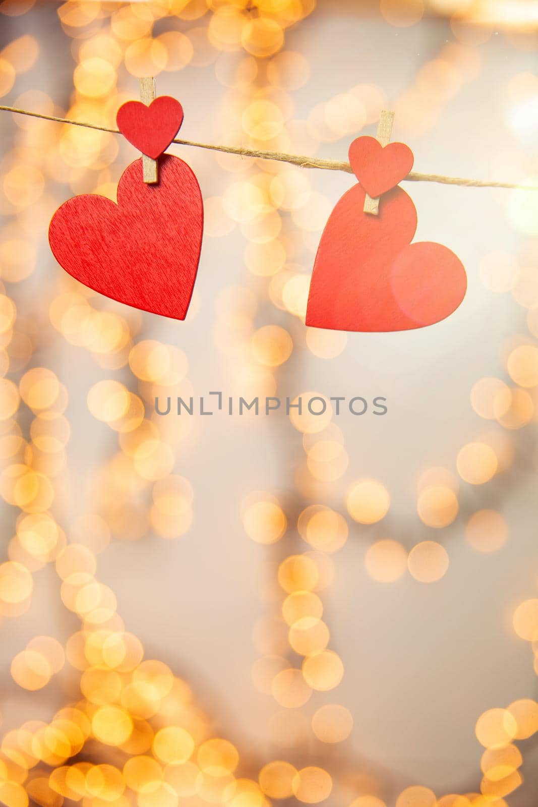 Happy Valentine day background with red hearts hang with clothespin on rope with bokeh background, romantic design, greeting card or copy space space for text