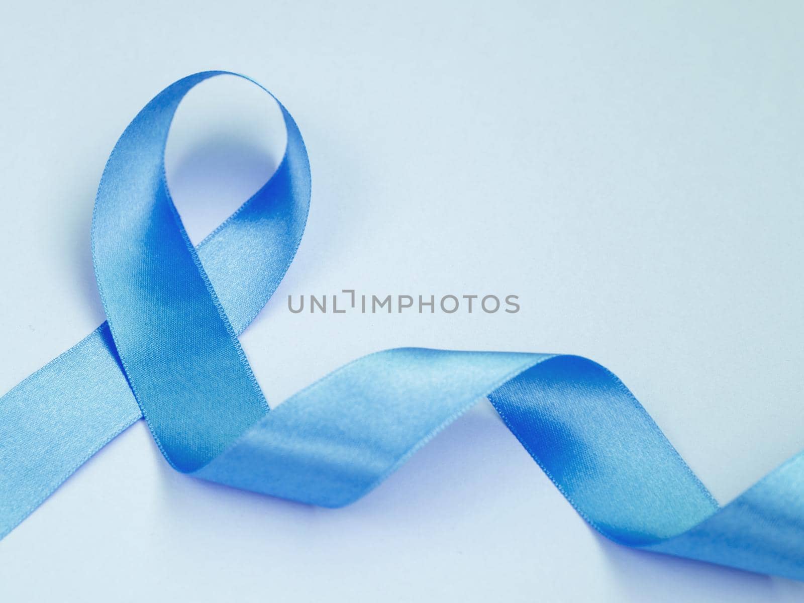 above view cancer concept with blue ribbon