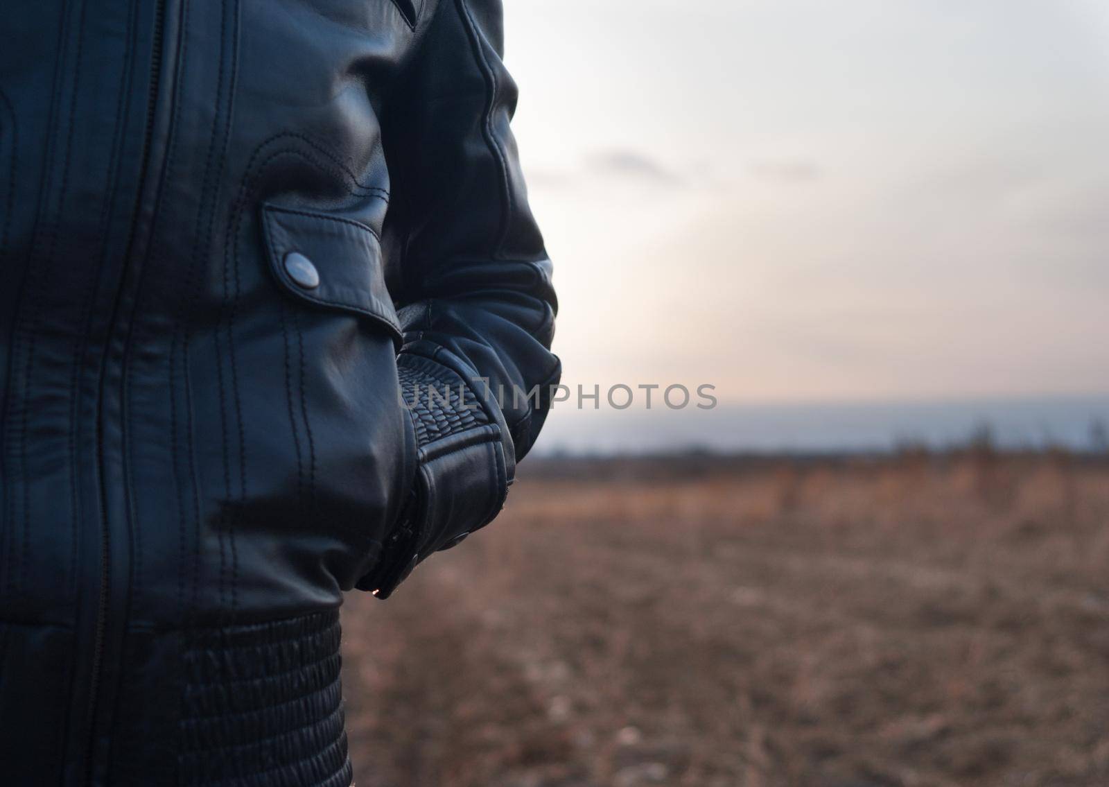 part of the body a woman wearing a black jacket