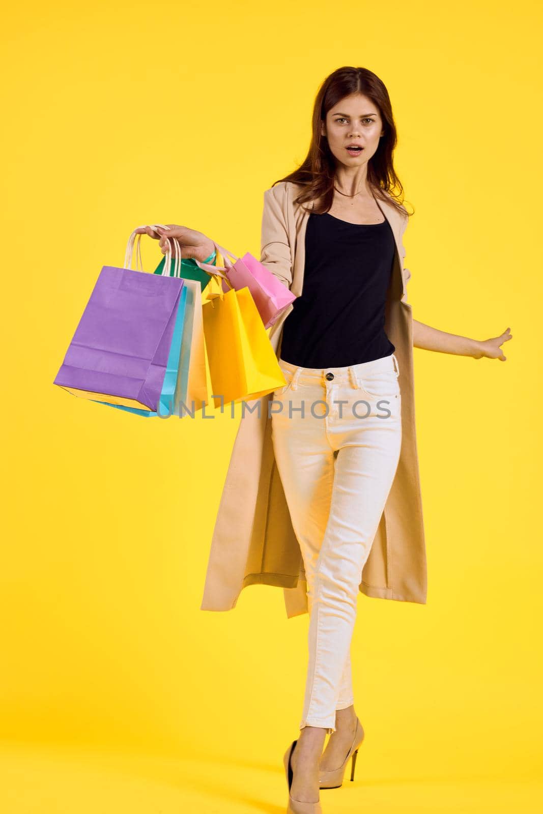 smiling woman shopping entertainment lifestyle studio model. High quality photo