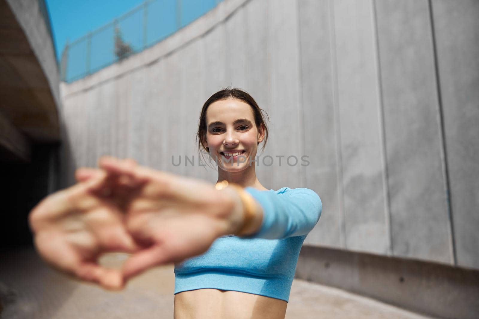 Beautiful fit young woman jogger is running outdoors