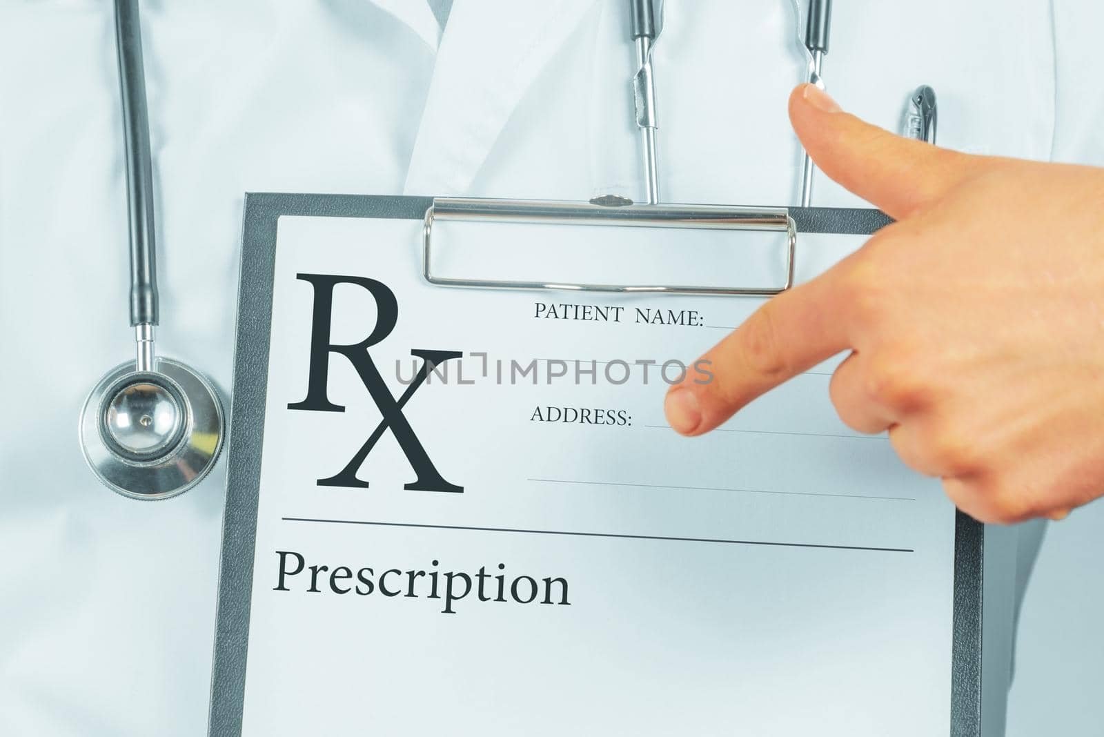 Unrecognizable man doctor pointing on clipboard with prescription list