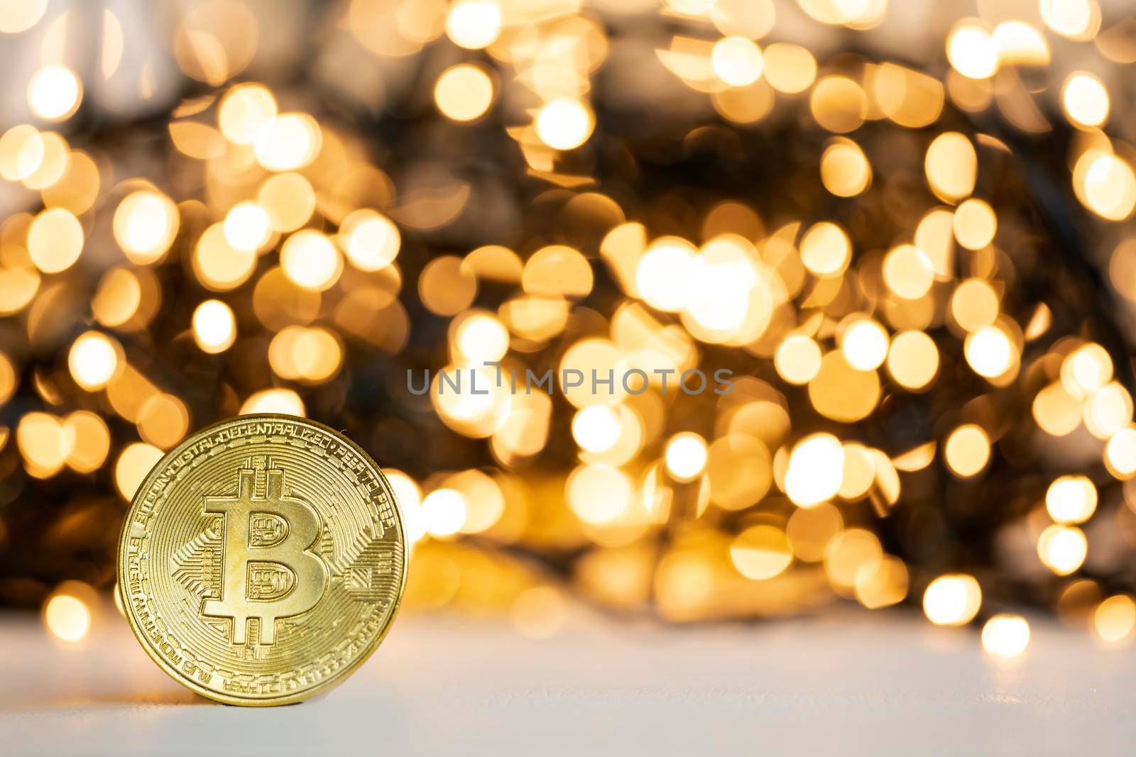 Golden bitcoin with yellow bokeh background. Cryptocurrency concept. Blockchain and digital crypto currency exchange concept. space for text by Annebel146