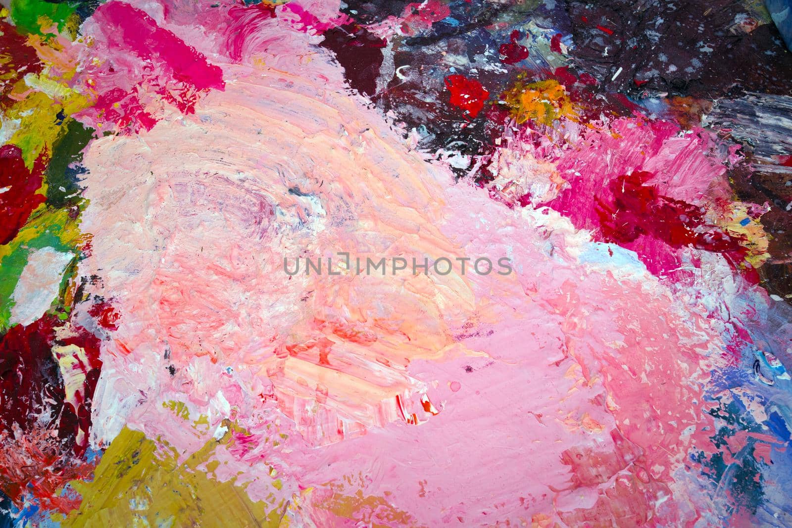 Various colors of paint, multi colored abstract oil paint stains background, bright colors painting copy space modern design