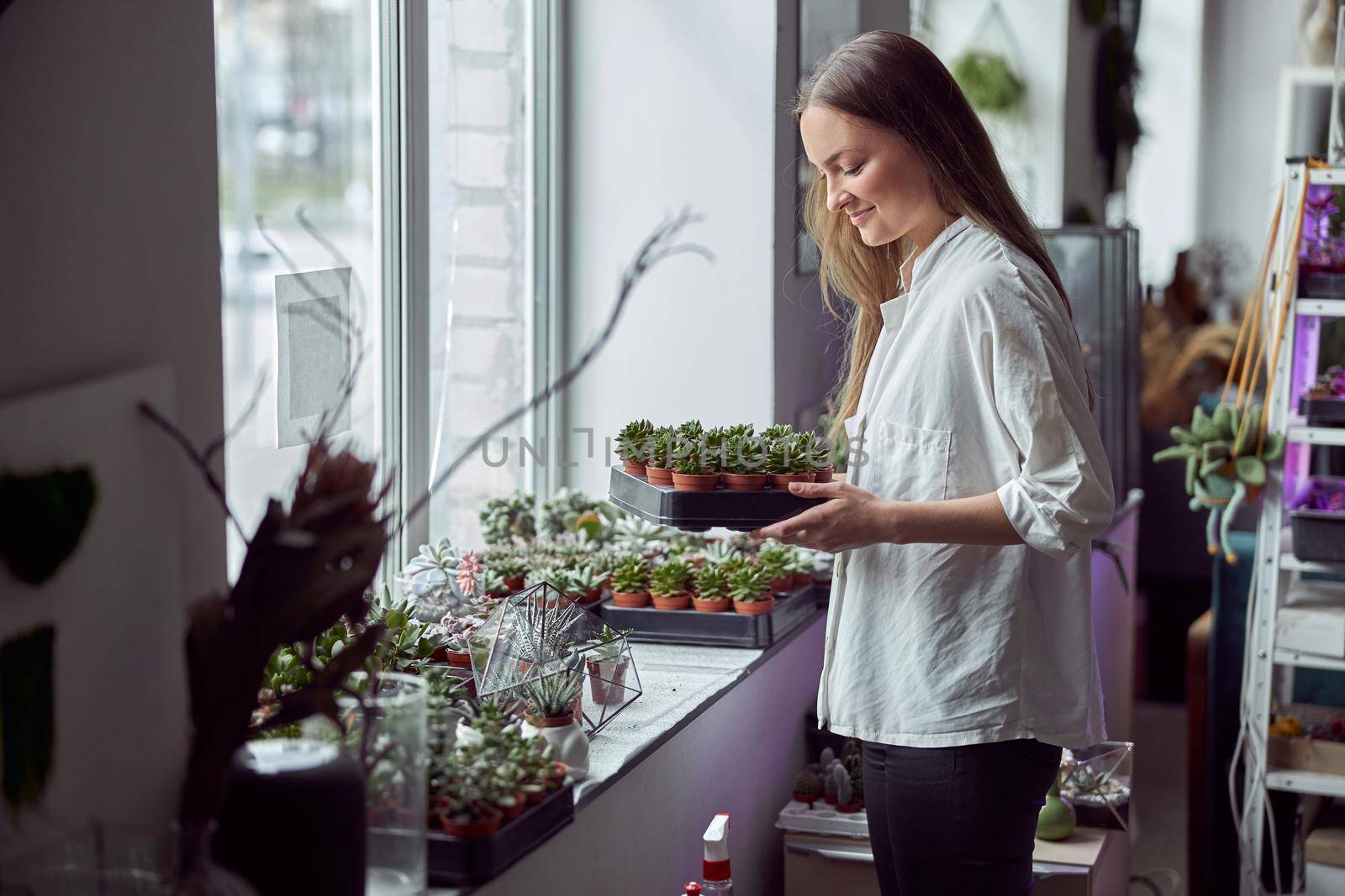 Portrait of caucasian female florist in its own florist shop