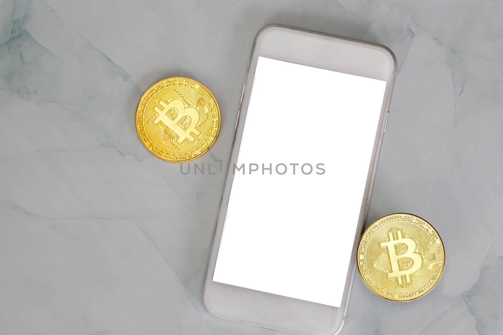 golden bitcoin lies on a smartphone on marble background top view with copy space, cryptocurrency or digital money concept , blacnk mobile phone by Annebel146