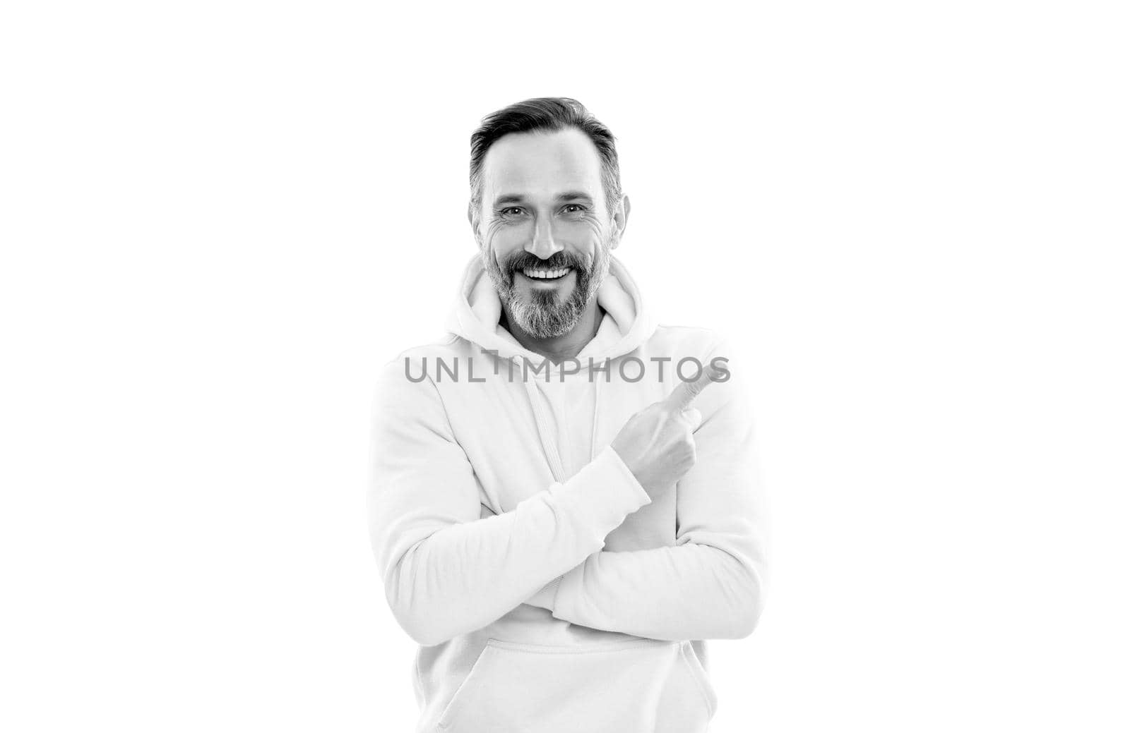 look here. adult guy advertising. male casual sporty fashion. copy space. mature happy man pointing finger. smiling senior guy presenting product isolated on white. advisor man in yellow hoody.