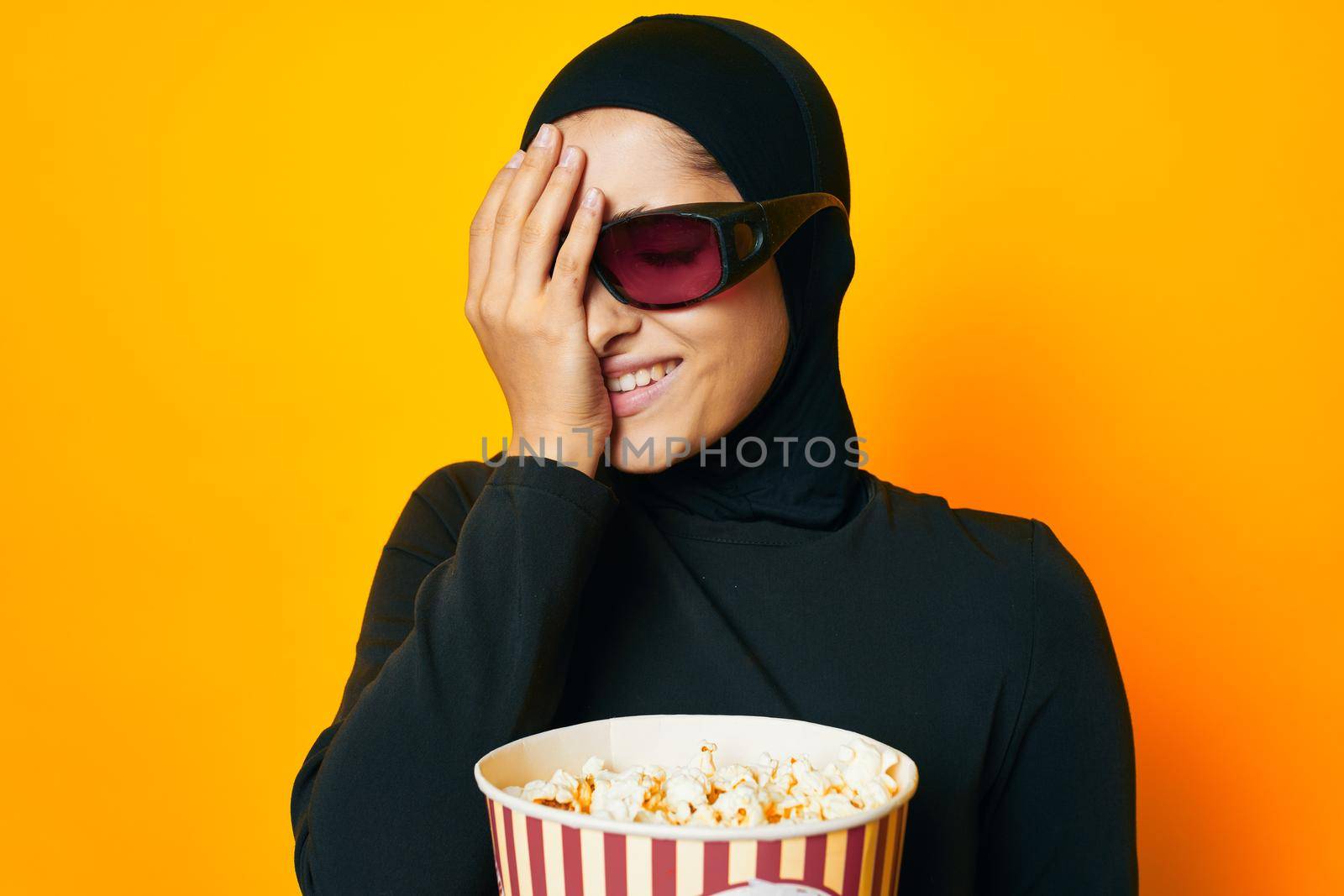 Muslim watching movies 3D glasses fun studio lifestyle. High quality photo