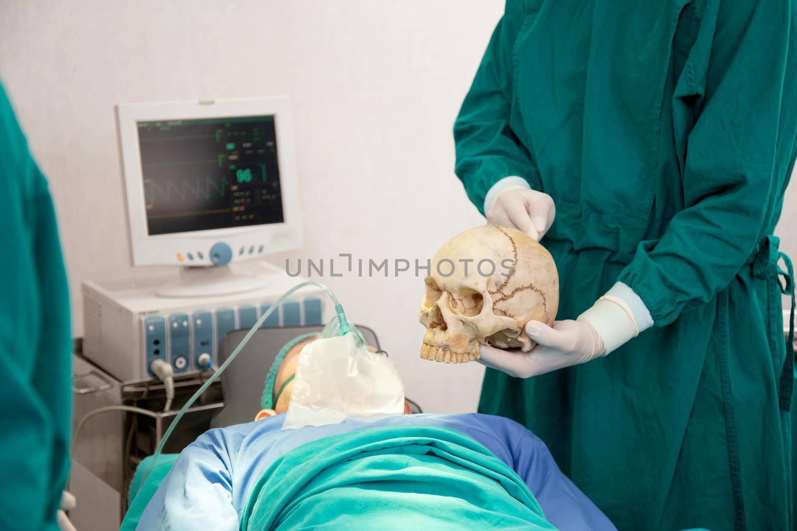 Team of doctor and surgeon explain about surgery skull and brain with assistant for rescue and save patient in the operation room at hospital, surgery and emergency, medical technology and health.