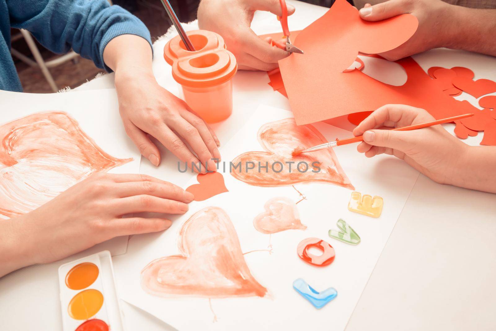 Family makes decorations for holiday