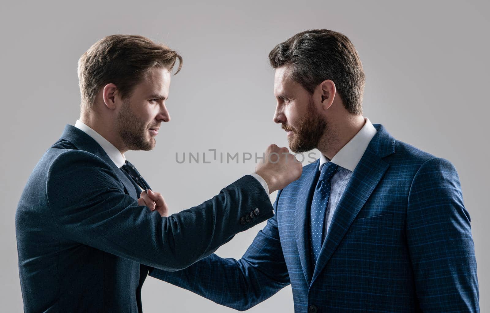 disagreed men business partners disputing aggressive and angry while conflict, discuss failure. by RedFoxStudio