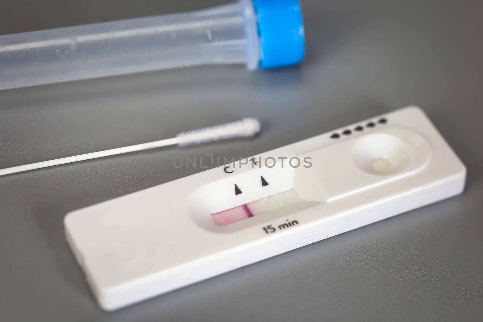 Rapid self test Covid-19 with nose swab, home test kit for coronavirus top view on gray background with copy space space for text negative result