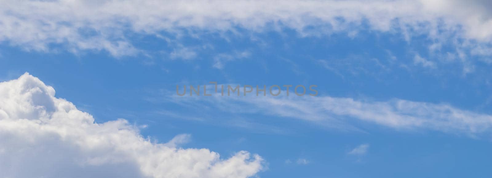 Background of blue sky with white clouds. High quality photo