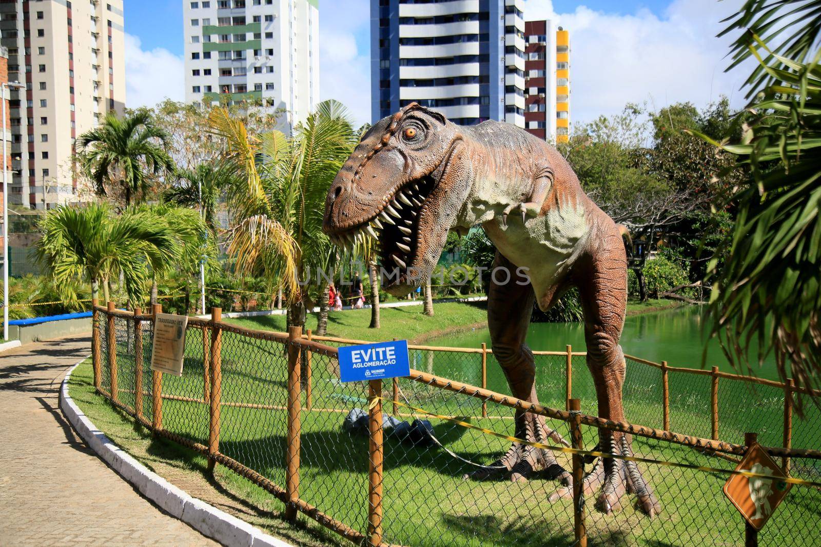 salvador, bahia, brazil - july 20, 2021: T-Rex dinosaur sculpture is seen in the Lagoa dos Dinossauros park in the city of Salvador.