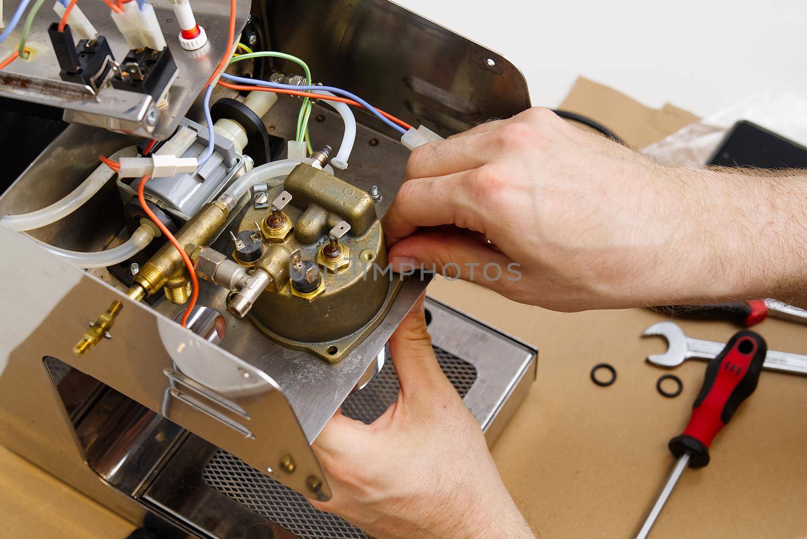 Repair of coffee machine at home. Spare parts for the espresso machine. Repair of kitchen appliances service concept