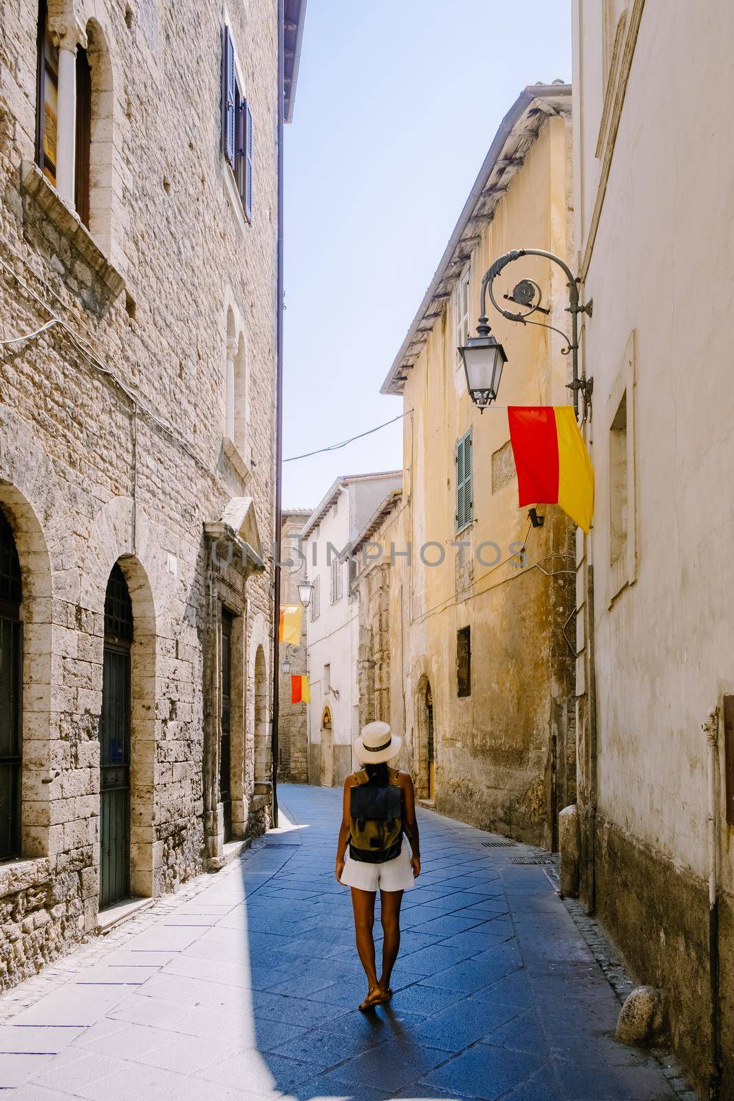 Overview of Fiuggi in Italy, Scenic sight in Fiuggi, Province of Frosinone, Lazio, central Italy. Europe, a woman walking on the colorful streets of Fiuggi. 