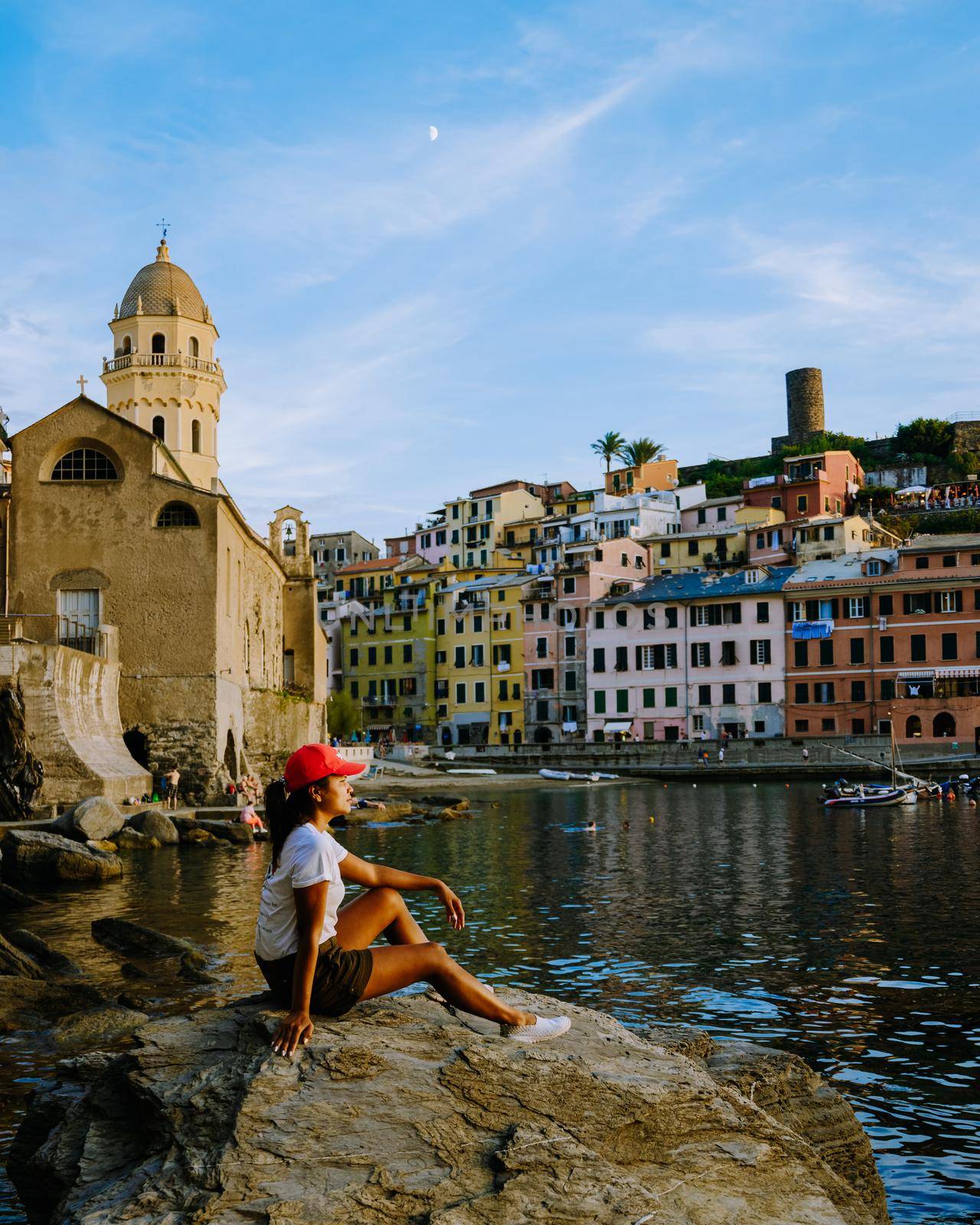 Cinque Terre, Italy, The picturesque coastal village of Vernazza, Cinque Terre, Italy woman watching sunset