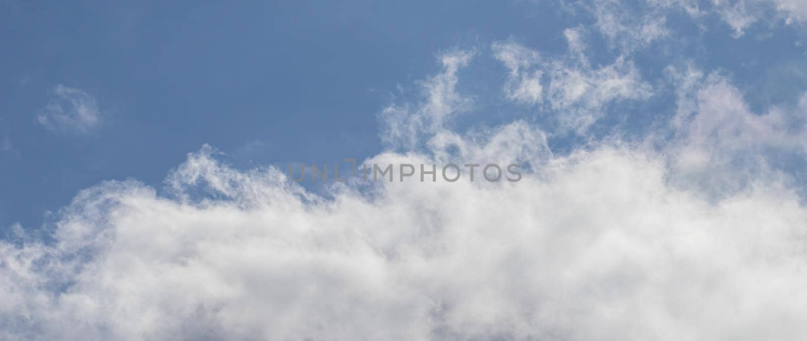 Background of blue sky with white clouds.