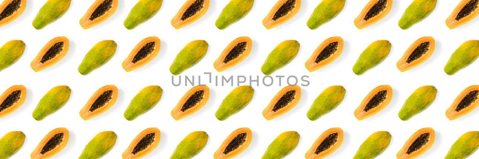 Fresh ripe papaya background on white backdrop. Modern tropical abstract background. Top view. Creative design, minimal flat lay concept. Trend tropical fruit food background - not seamless pattern