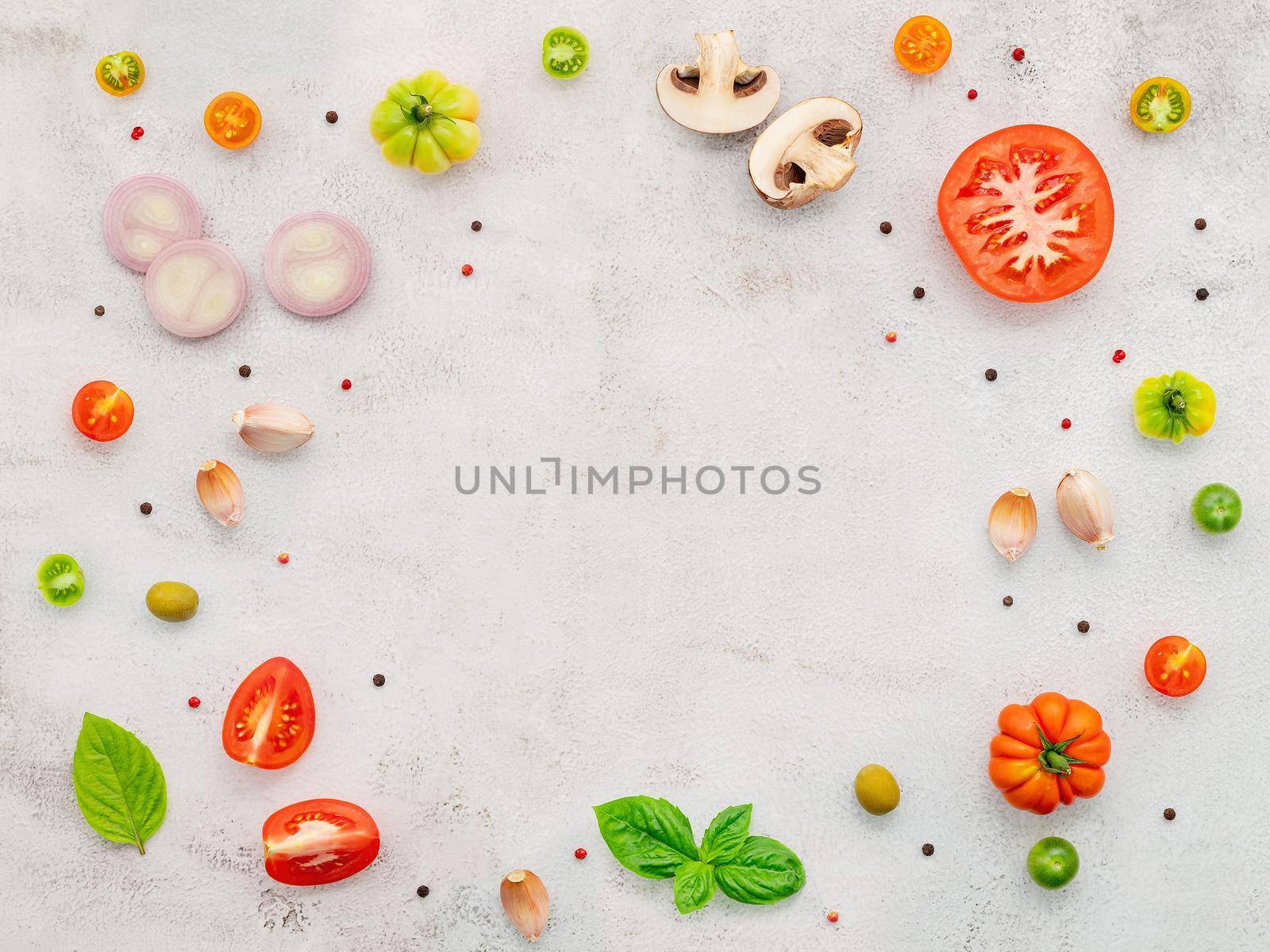 The ingredients for homemade pizza set up on white concrete background. by kerdkanno