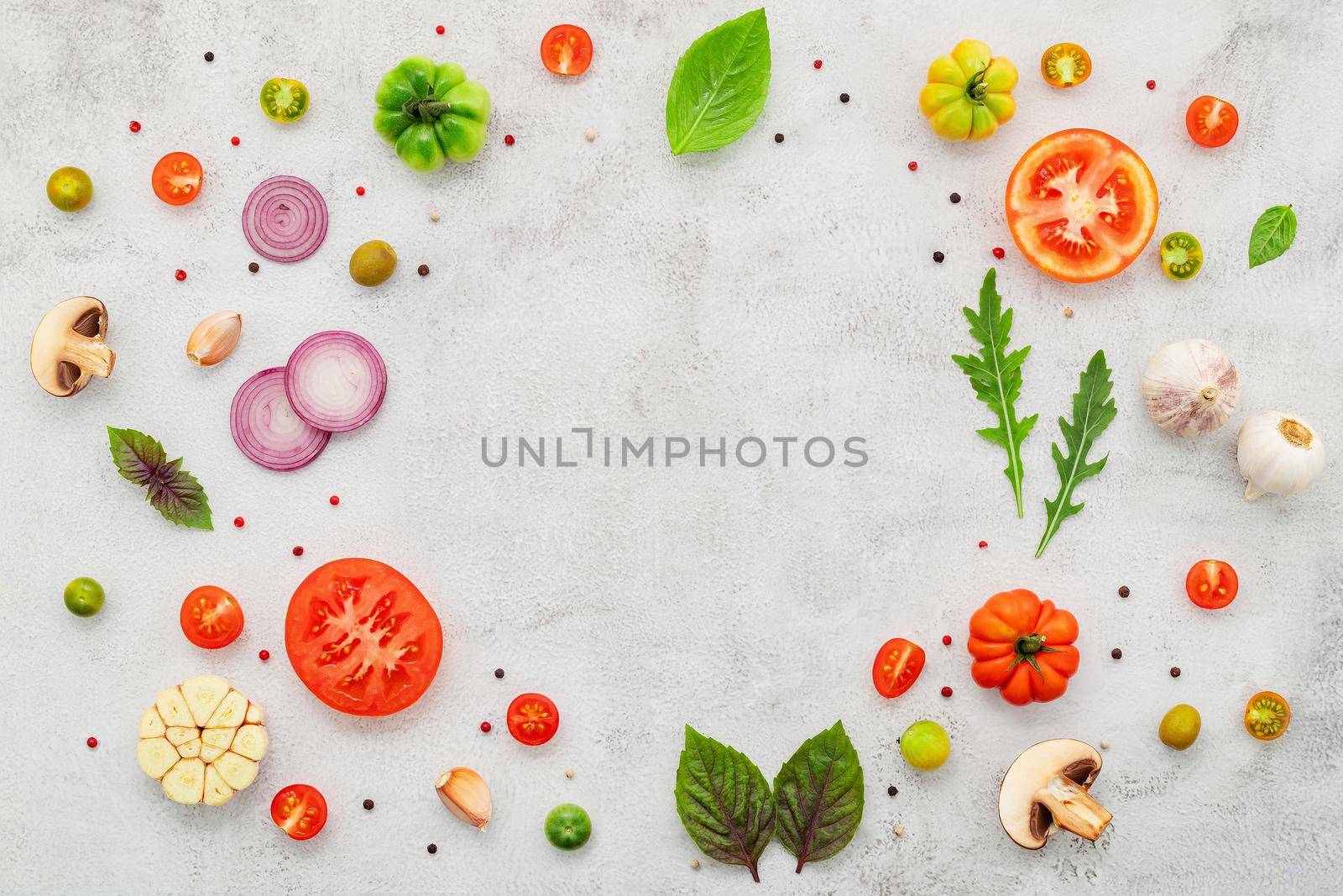The ingredients for homemade pizza set up on white concrete background  flat lay and copy space. by kerdkanno