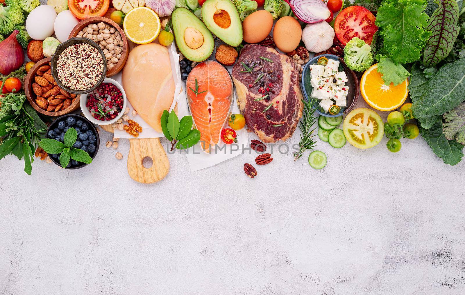 Ketogenic low carbs diet concept. Ingredients for healthy foods selection set up on white concrete background.  by kerdkanno