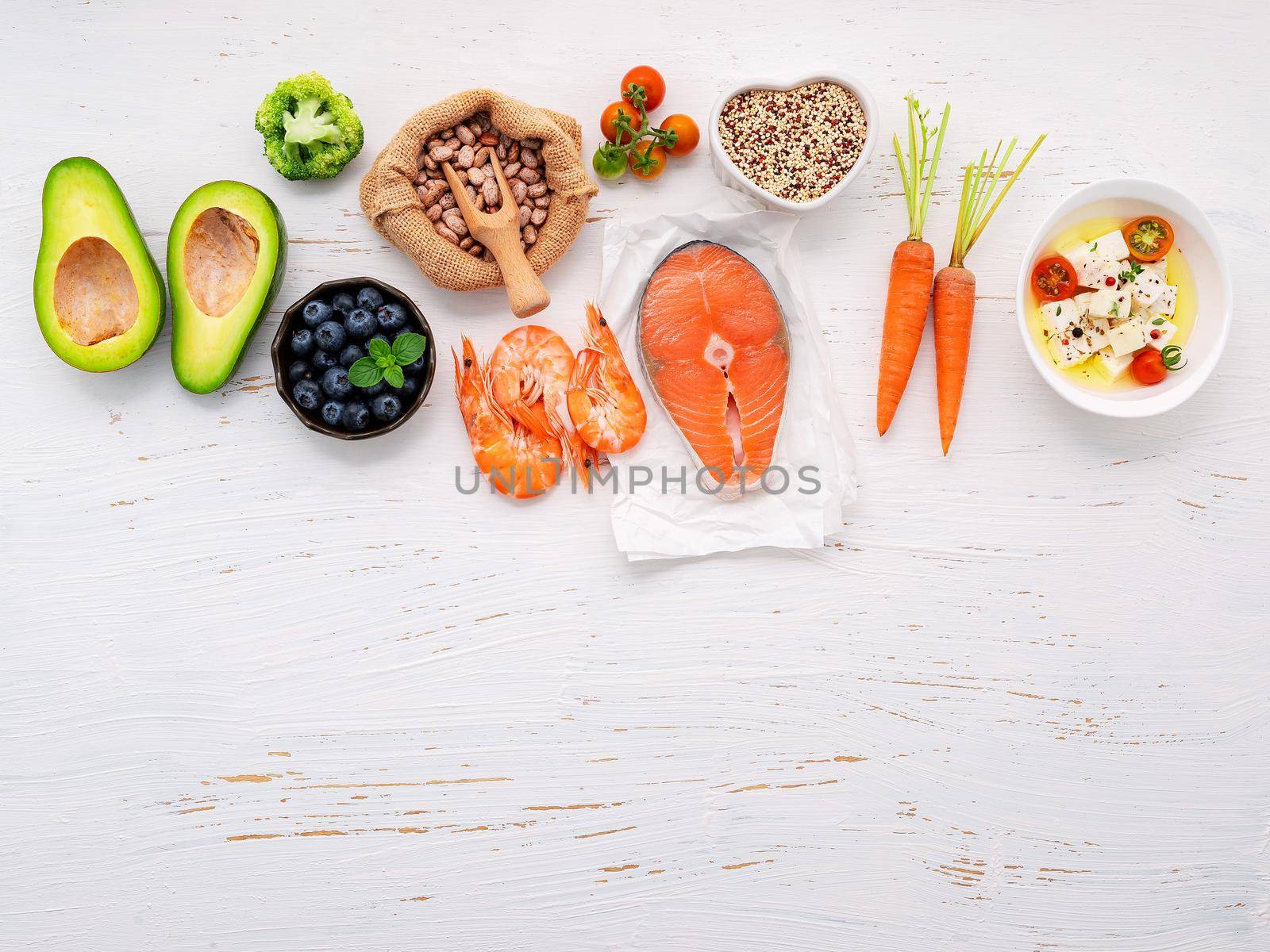 Ketogenic low carbs diet concept. Ingredients for healthy foods selection set up on white wooden background. by kerdkanno