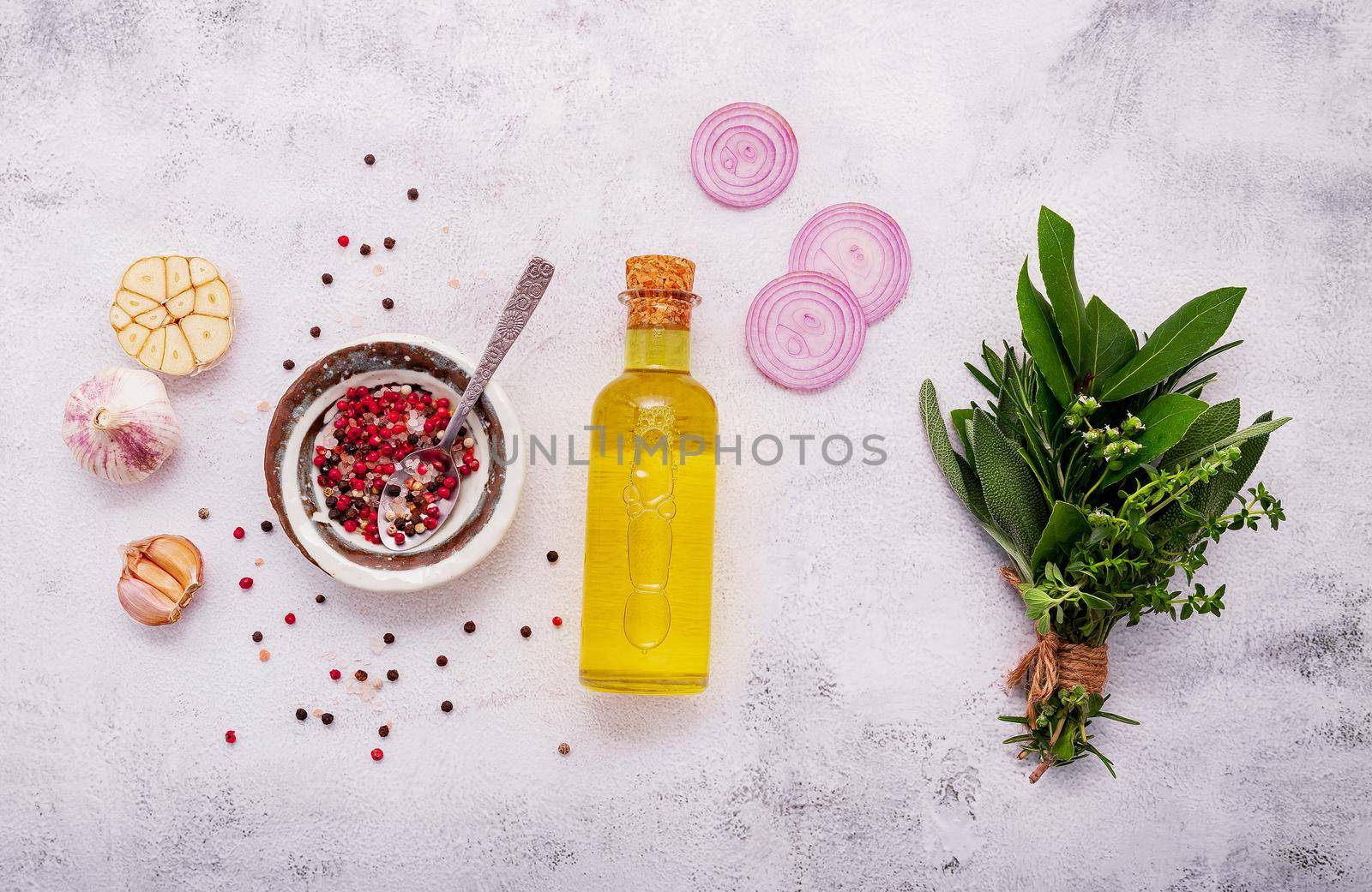 Ingredients for steak seasoning in ceramic bowl set up on white concrete background with copy space.
