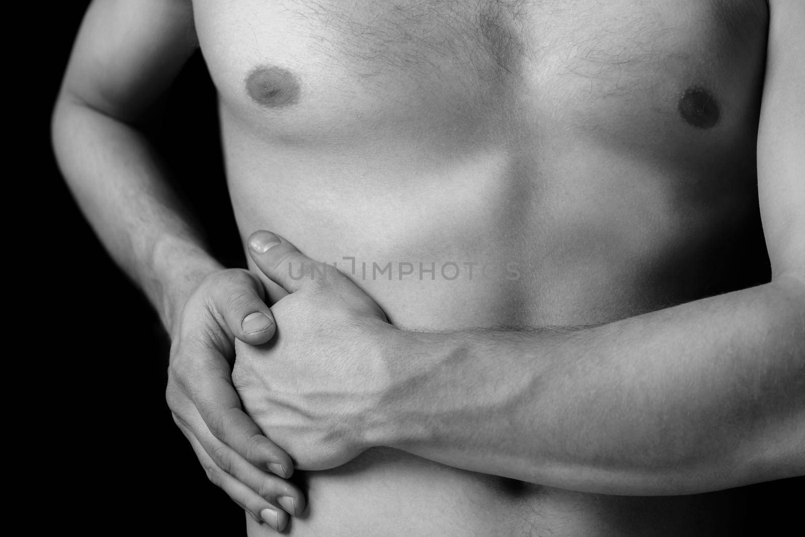 Man holds on the right side of the abdomen, concept of pain