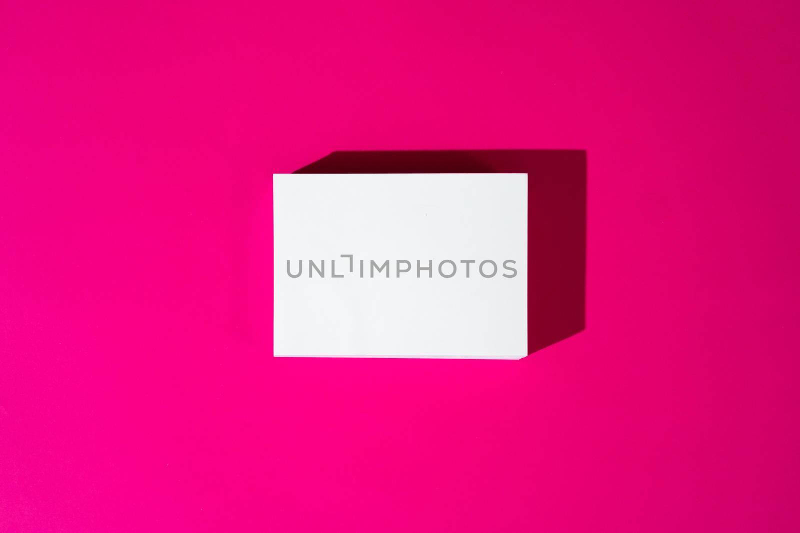 Mock-up on pink background. Businesscards with copy space close up