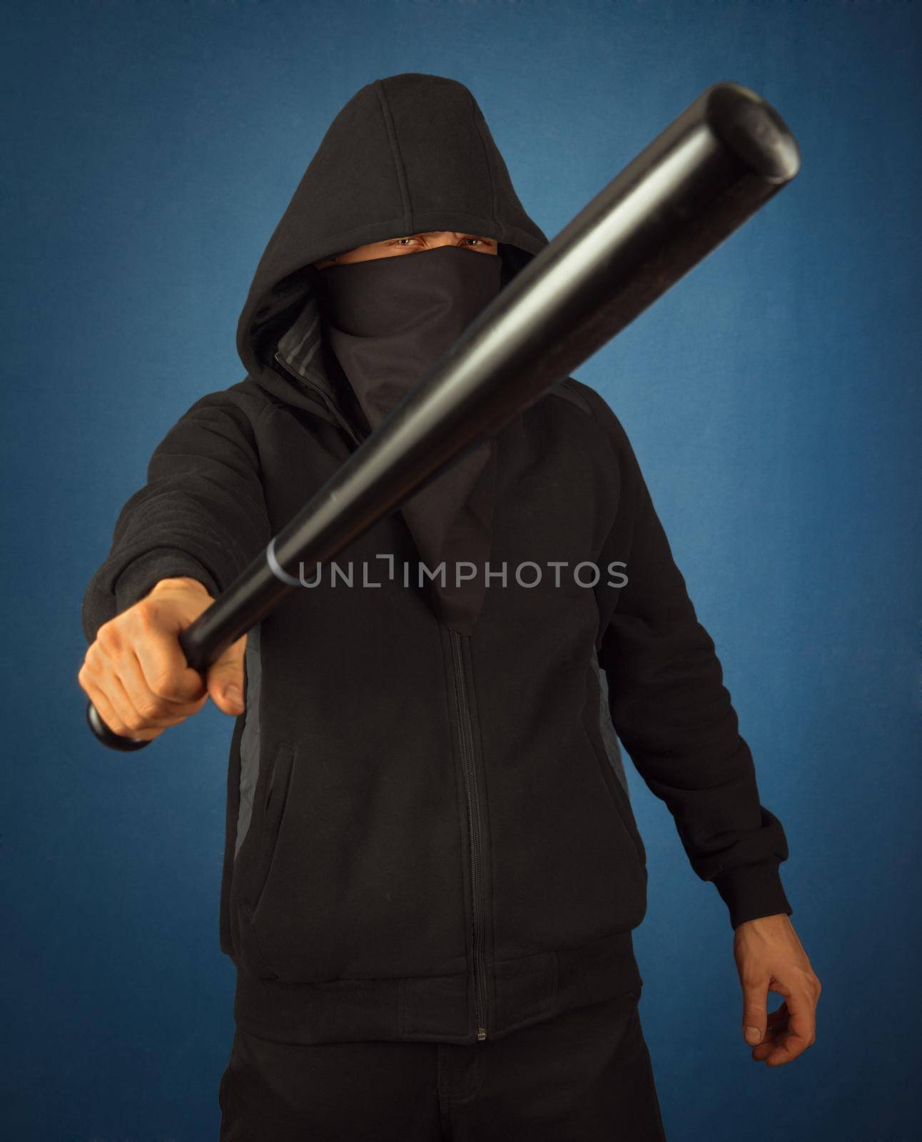 Dangerous man with baseball bat ready for fight