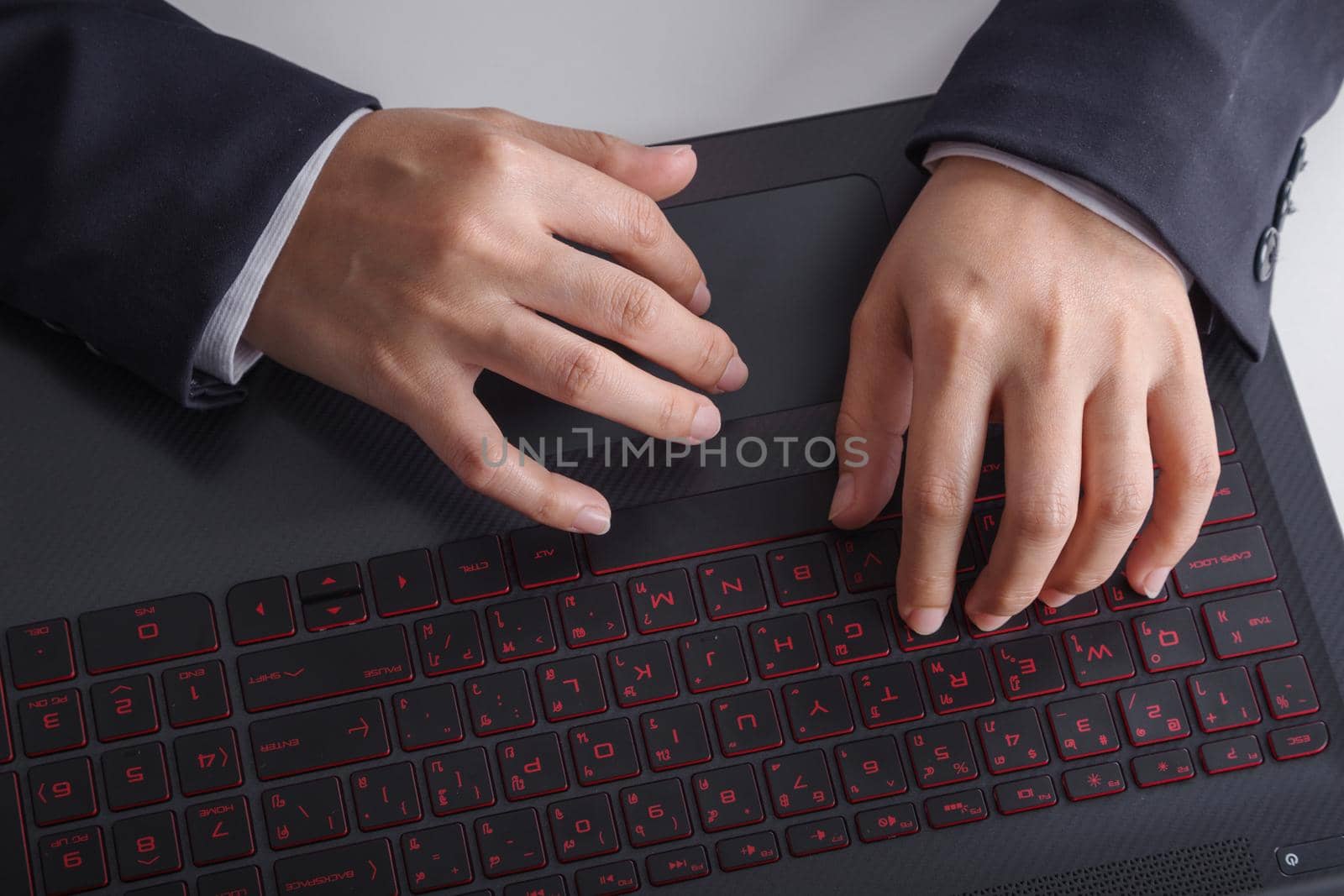 business hand typing keyboard of laptop by geargodz