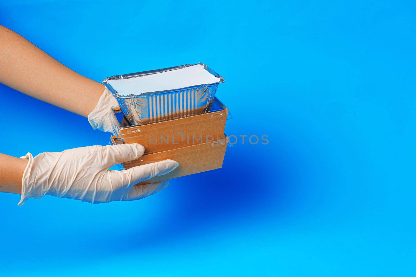 Delivery man hands giving food containers and packages. Delivery concept